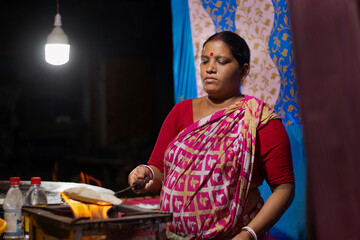 Cook of a local roadside restaurant, making bread or a roti, Local Street Food Shop Restaurant Street Vendor