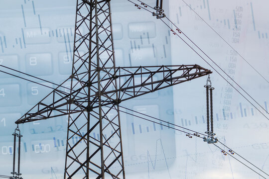 High voltage electricity pole with calculator calculations and market stock chart and index information in the background. Electricity market concept, energy price changes