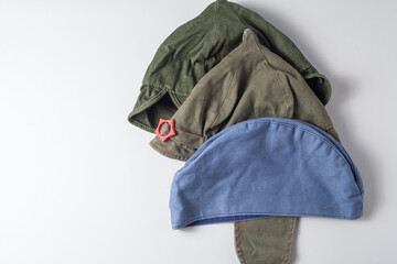 Three hats of different colors of the Russian army. green and blue caps