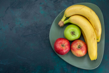 top view fresh apples with bananas on dark-blue desk fruit mellow fresh tropical exotic - obrazy, fototapety, plakaty