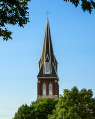 a church tower against blue sky