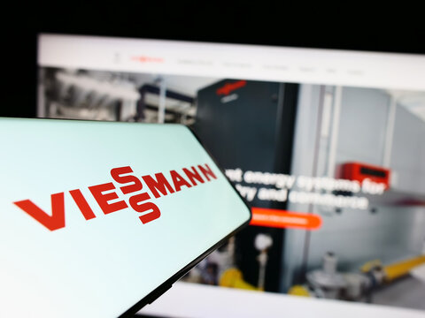 Stuttgart, Germany - 04-28-2023: Mobile phone with logo of German company Viessmann Group GmbH Co. KG on screen in front of business website. Focus on center of phone display.