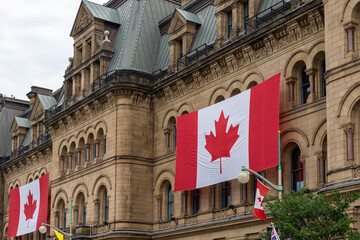 Canada Day. Canadian flags on building. Office of the Prime Minister and Privy Council in Ottawa. - obrazy, fototapety, plakaty