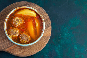 top view meat balls soup with potatoes inside round plate on dark-blue desk food soup meat dish dinner vegetable