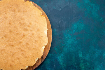 top view plain cake dough baked round formed on dark-blue desk cake bake sweet sugar dough pie - obrazy, fototapety, plakaty