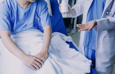 Doctor telling to patient woman the results of her medical tests. Doctor showing medical records to cancer patient in hospital ward. Senior doctor explaint the side effects of the intervention.