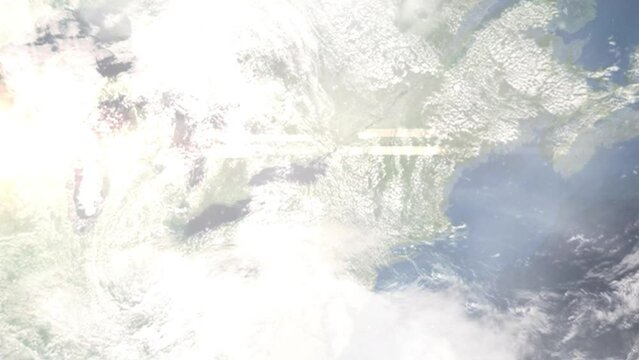 Earth zoom in from outer space to city. Zooming on Oswego, New York, USA. The animation continues by zoom out through clouds and atmosphere into space. Images from NASA