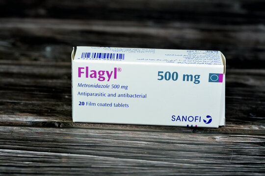 Cairo, Egypt, May 4 2023: Flagyl metronidazole 500mg tablets,  Amebicides, an antibiotic that is used to treat bacterial infections of the vagina, stomach, liver, skin, joints, brain and spinal cord