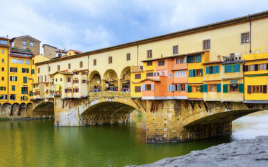 Fototapeta na wymiar Ponte Vecchio bridge over the river Arno in Florence Italy. Florence is a popular tourist destination of Europe.