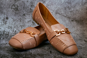 Pink women's shoes with a dark antique background