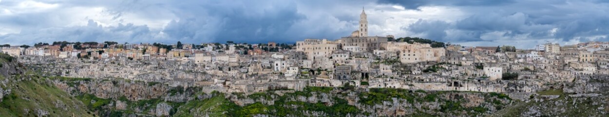 Fototapeta na wymiar Matera, Italy. Amazing view of the Sassi of Matera. Landscape of the historical part of the town. An Unesco World Heritage Site. Touristic destination