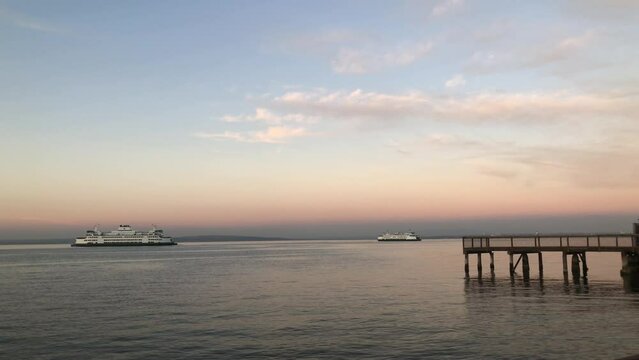 Sunset over the ocean and ferries