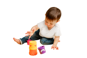 Toddler baby is playing logical educational games with a sandbox mold on a studio isolated on a white background. Happy child playing with an educational toy bucket. Kid aged one year four months
