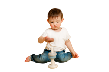 Toddler baby is playing logic educational games with a pyramid on a studio isolated on a white background. Happy child playing with a pyramid educational toy. Kid aged one year four months