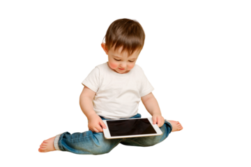 Toddler baby with a digital tablet on a studio isolated on a white background. Happy child playing with a tablet in a white t-shirt and blue jeans