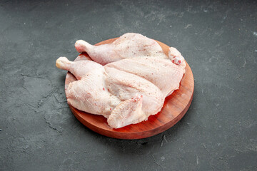 front view fresh raw chicken on a dark background cooking dish food salad barbecue color dinner bird