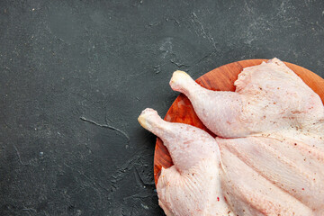 top view fresh chicken on dark background cooking dish food salad barbecue color dinner bird