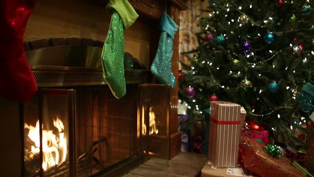 Christmas tree with stockings and fireplace