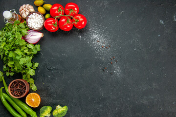 top view fresh red tomatoes with greens and seasonings on dark background salad ripe health diet food meal color