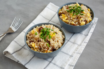 Homemade Fried Rice with Bacon and Egg in a Bowl, side view.