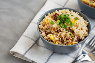 Homemade Fried Rice with Bacon and Egg in a Bowl, side view. Space for text.