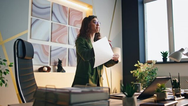 Angry woman talking web chat in office. Manager quarrelling at video conference.
