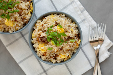 Homemade Fried Rice with Bacon and Egg in a Bowl, top view. Flat lay, overhead, from above.