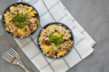 Homemade Fried Rice with Bacon and Egg in a Bowl, top view. Flat lay, overhead, from above.