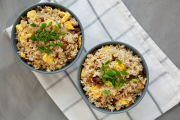 Homemade Fried Rice with Bacon and Egg in a Bowl, top view. Flat lay, overhead, from above.