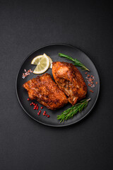 Delicious fried sea bass fish in the form of slices with spices and herbs
