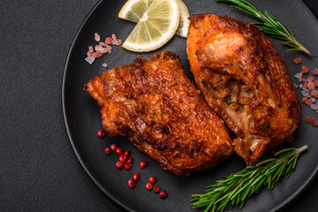 Delicious fried sea bass fish in the form of slices with spices and herbs