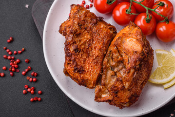 Delicious fried sea bass fish in the form of slices with spices and herbs