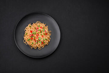 Delicious fresh Asian noodles with vegetables, salt, spices and herbs