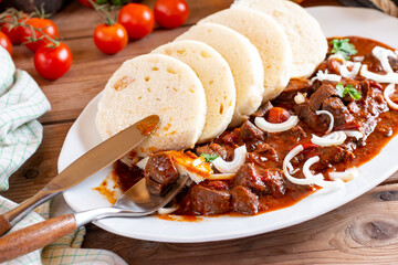 Classic Czech goulash with dumplings, delicious food, homemade Karlovarsky dumplings