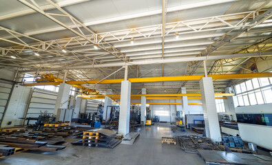 Factory workshop warehouse. Metal sheets indoor storage.