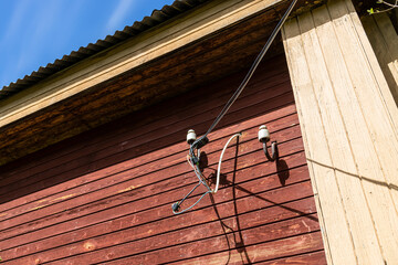 homemade outdoor wiring of electrical wires to wooden village house
