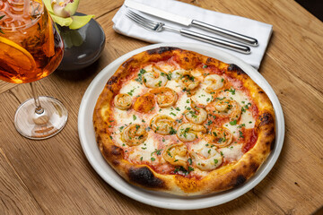 delicious italian pizza on a wooden table
