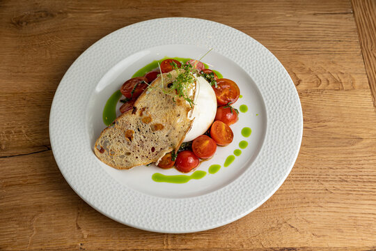 delicious buratta cheese on a white plate
