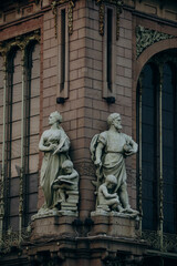 Beautiful sculptures on an old building in modern and classical style.
