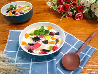 Es Buah or Sop Buah, Indonesian cocktail dessert. Cold and sweet beverage, made of various kind of tropical fruit with milk and liquid sugar or syrup as sweetener. Suitable for summer drink