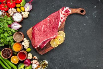 top view raw meat slice with vegetables greens and seasonings on dark background ripe health diet food meal color salad