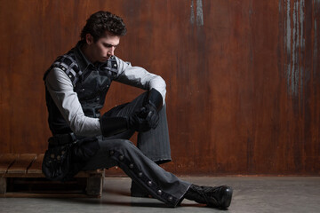 A young man in a Victorian-style suit, a retro character. Antihero or tragic character
