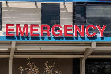 Fototapeta na wymiar Emergency Room and Emergency Department entrance sign for a hospital in alert red.