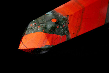 Close up of a Bloodstone Jasper mineral specimen cut into an Oblelisk