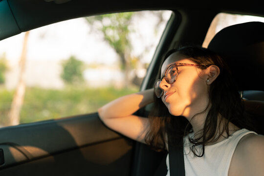 Exhausted Female Passenger in Car