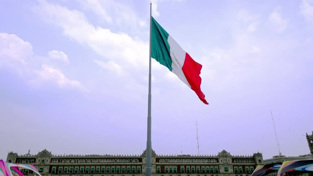Mexican flag waving with blue sky and clouds and the national palace in the background in Mexico City  - Flag Waving, Mexico Flag 4k video