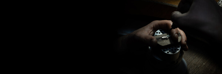 Different goldsmiths tools on the jewelry workplace. Jeweler at work in jewelry. Desktop for craft...