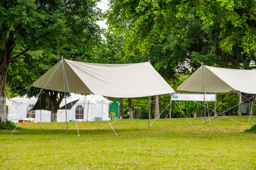 Camping tents on green grass in the park