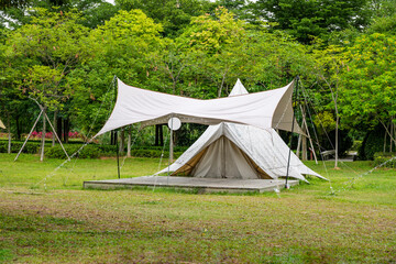 Camping tents on green grass in the park