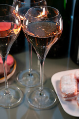 Tasting of rose brut Champagne sparkling wine in cellars of gran cru wine house in Epernay, wine tour in Champagne, France